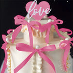 décoration gâteau mariage ruban nœud rouge rose glaçage texturé nacrées festive