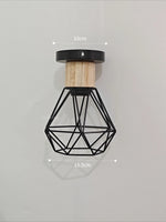 suspension lumineuse industrielle cage métal finition bois naturel ampoule filament noir moderne