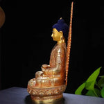 statue bouddha or bleu rouge relief orné tibétain traditionnel asiatique maison prière