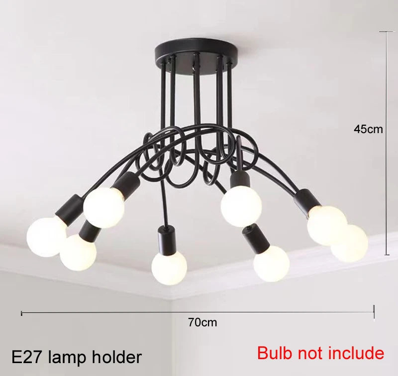suspension lumineuse moderne noir doré ampoules blanches structure spirale fixation câbles métallique