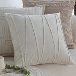 coussin motif feuilles stylisées beige clair moderne opacité 45x45cm franges fixation