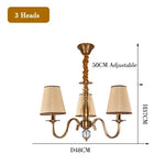 chandelier bronze classique suspension lumière abat jours tissu texturé courbes salle manger