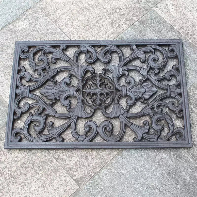 Paillasson fonte vintage noir motif vigne sur seuil de porte
