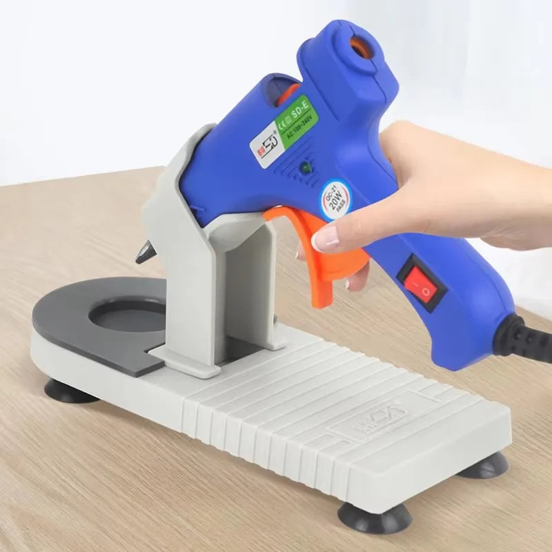 support pistolet colle chaude réutilisable gris bleu orange texturé industriel pieds stabilisation cordon électrique