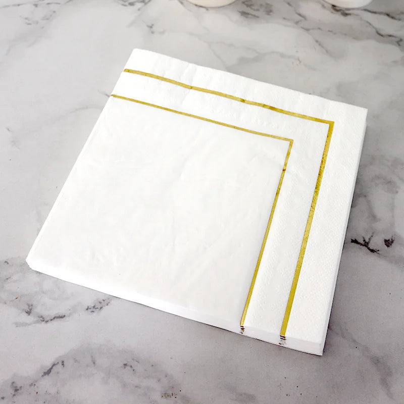 serviettes papier blanc doré classiques occasions festives mariage anniversaire élégantes lignes dorées simples texture