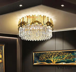 lampe moderne or cristal transparent élégante barres dorées inoxydables salon hall