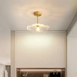 lampe suspendue or transparente motif floral texture ondulée moderne élégante tringle câble