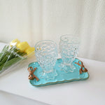 plateau rétro ornements dorés vert pastel rose blanc rouge vintage élégant clips dorés