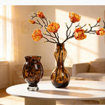 vases modernes translucides opaques motifs tourbillonnaires branches fleurs artificielles marron orange beige