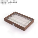 boîte bijoux contemporaine transparente compartiments blancs texture bois poignée métallique minimaliste organisation trousse toilette