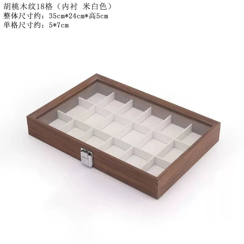 boîte bijoux contemporaine transparente compartiments blancs texture bois poignée métallique minimaliste organisation trousse toilette