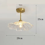 lampe suspendue or transparente motif floral texture ondulée moderne élégante tringle câble