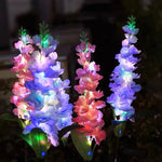décoration extérieure fleurs lumineuses solaires jaune bleu rose violet piquet métallique moderne festive jardin