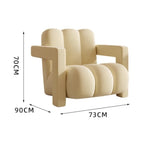 fauteuil moderne tissu texturé beige jaune marron clair coussin décoratif salon minimaliste
