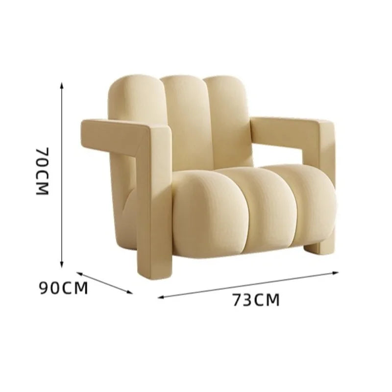 fauteuil moderne tissu texturé beige jaune marron clair coussin décoratif salon minimaliste