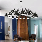 chandelier moderne suspension bras articulés noir blanc bois clair lumière