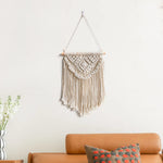 tapisserie macramé bohème beige clair motifs géométriques franges opaques décorative art murale