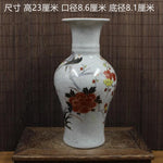 Vase décoratif en céramique craquelée avec des motifs floraux colorés.