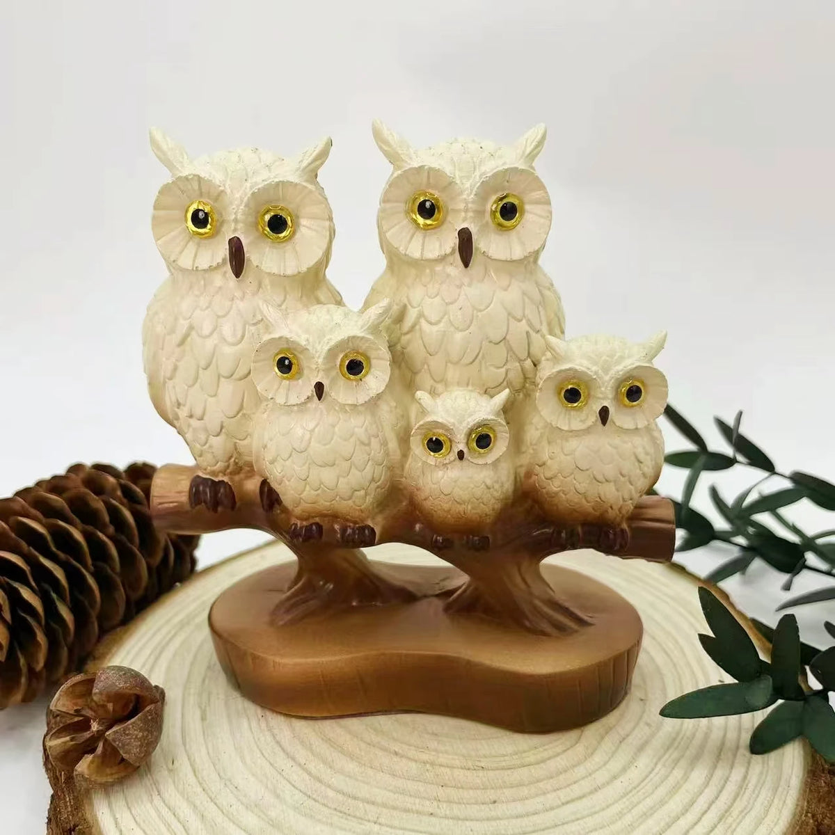 décoration maison sculpture oiseau plumes détaillées yeux dorés blanc brun artisanal réaliste