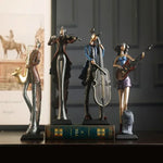 statues musiciens noir bleu doré texture métallique art deco instruments musicaux base solide vintage