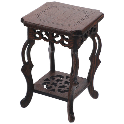 table basse bois sculptée motifs classiques décoration extérieure intérieure vintage marron foncé