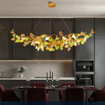 suspension lumineuse moderne dorée branches pierres couleur blanc orange vert