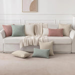 coussins carrés vert clair beige rose pâle texture tissée pompons moderne fermeture glissière