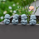 statues moines résine gris texture granulée art artisanal jardin zen serein souriantextérieur decoration