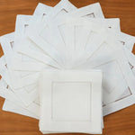 serviettes lin blanc bord brodé table mariage classique assiette blanche