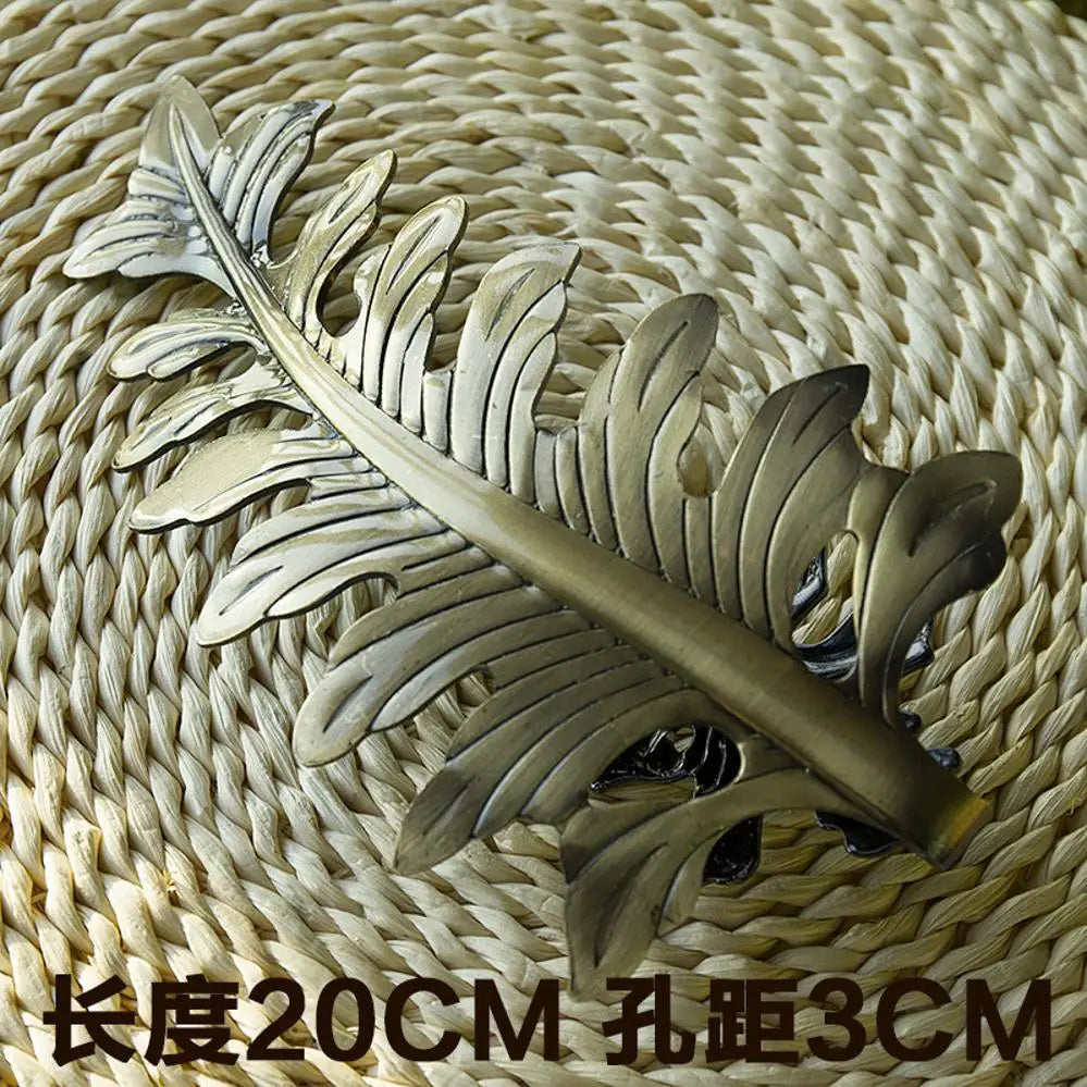 pince rideau métal moderne feuille stylisée argent doré cuivre opaque