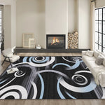 Un tapis abstrait aux motifs géométriques noirs et blancs décore élégamment le salon avec une cheminée murale et des éléments de décoration sur une étagère.