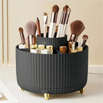 organisateur maquillage rotatif blanc rayures verticales moderne pieds dorés compartiments pinceaux crayons lèvres soins