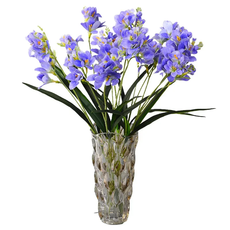 décoration intérieure bouquet artificielle orchidée blanc bleu rose feuilles verte moderne minimaliste