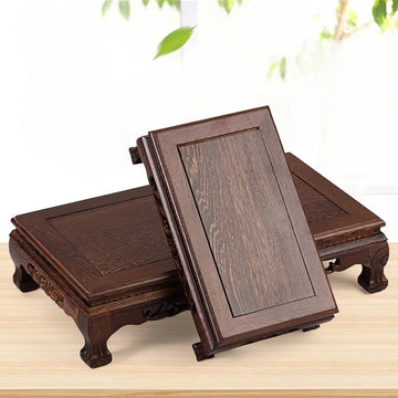 table basse bois sculptée asiatique traditionnel motifs animaux pieds decoration marron foncé rouleau papier