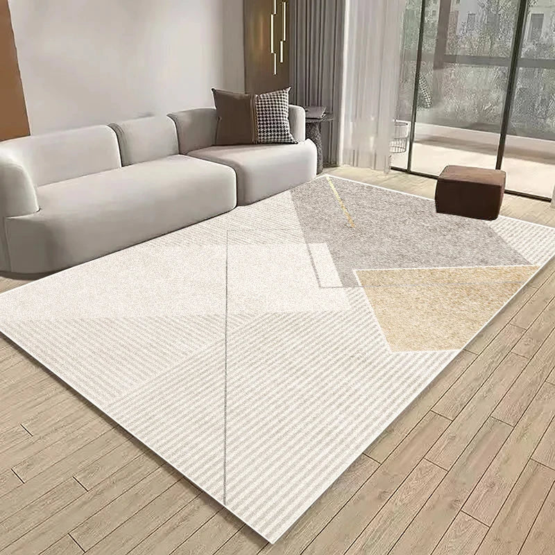 Un lumineux salon moderne avec un canapé gris, un tapis géométrique et une fenêtre donnant sur l'extérieur.