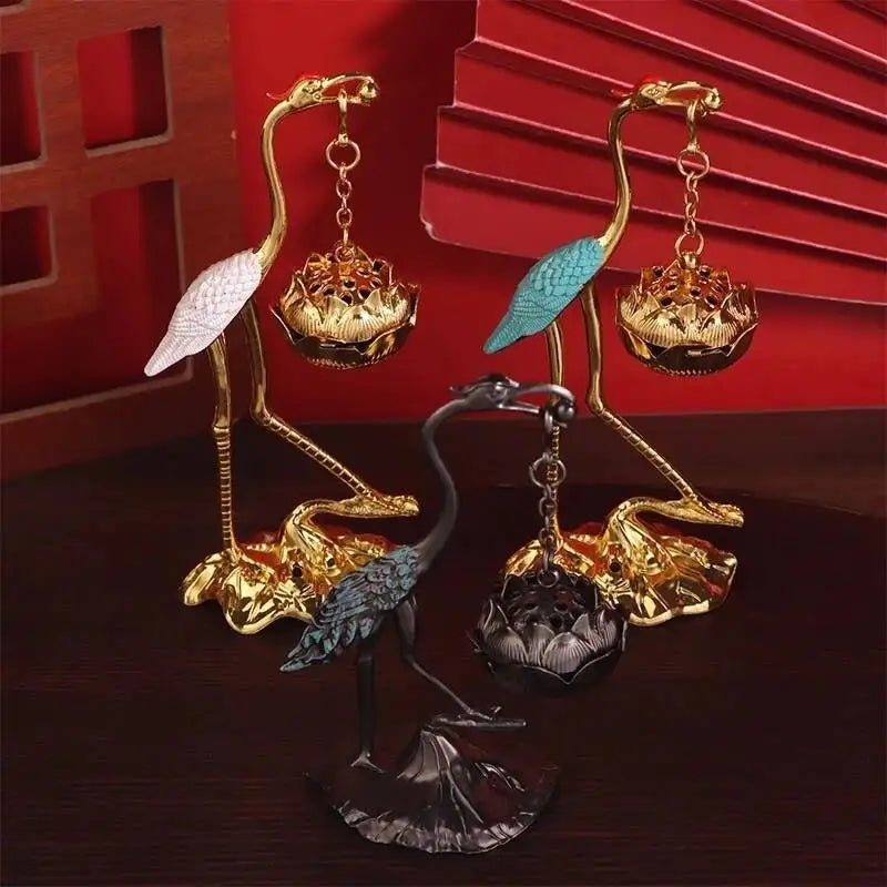 statuette oiseau or noir bleu artisanal élégant décoration maison motif floral support métal