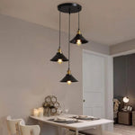 suspension lumineuse industrielle conique noire dorée ampoules câbles chambre salon