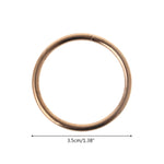 anneaux suspension dorés ronds concentriques métal opaques tailles variées moderneintérieurcoration minimaliste
