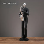 statue musicien moderne abstraite saxophone guitare noire décoration intérieure couple instrumental résine opaque base