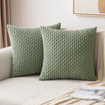 coussins carrés vert clair beige rose pâle texture tissée pompons moderne fermeture glissière