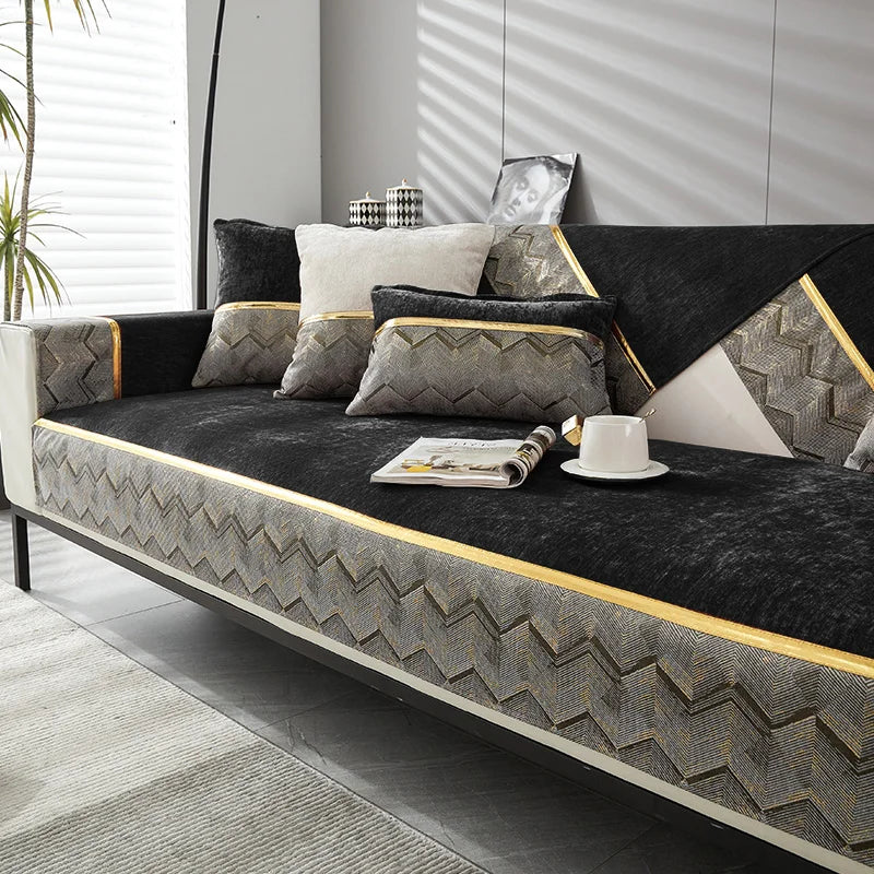 Un canapé d'angle moderne, aux motifs géométriques, avec de beaux coussins et des touches dorées, offrant un design élégant et confortable dans un environnement épuré.