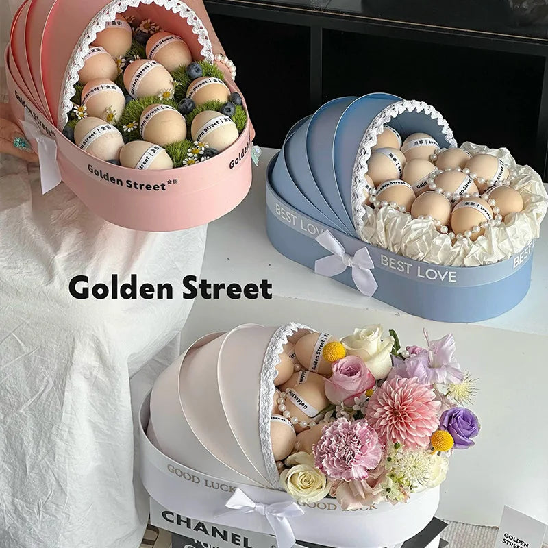 boîte cadeau pâques bleu clair rose fleurs artificielles ruban blanc classique élégante réception bébé