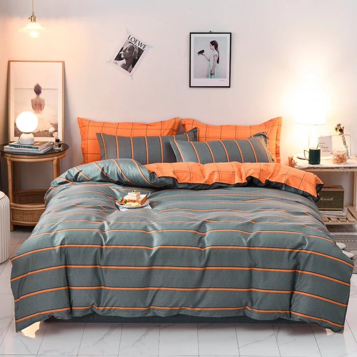Housse de couette rayée grise et orange réversible sur lit Queen Size