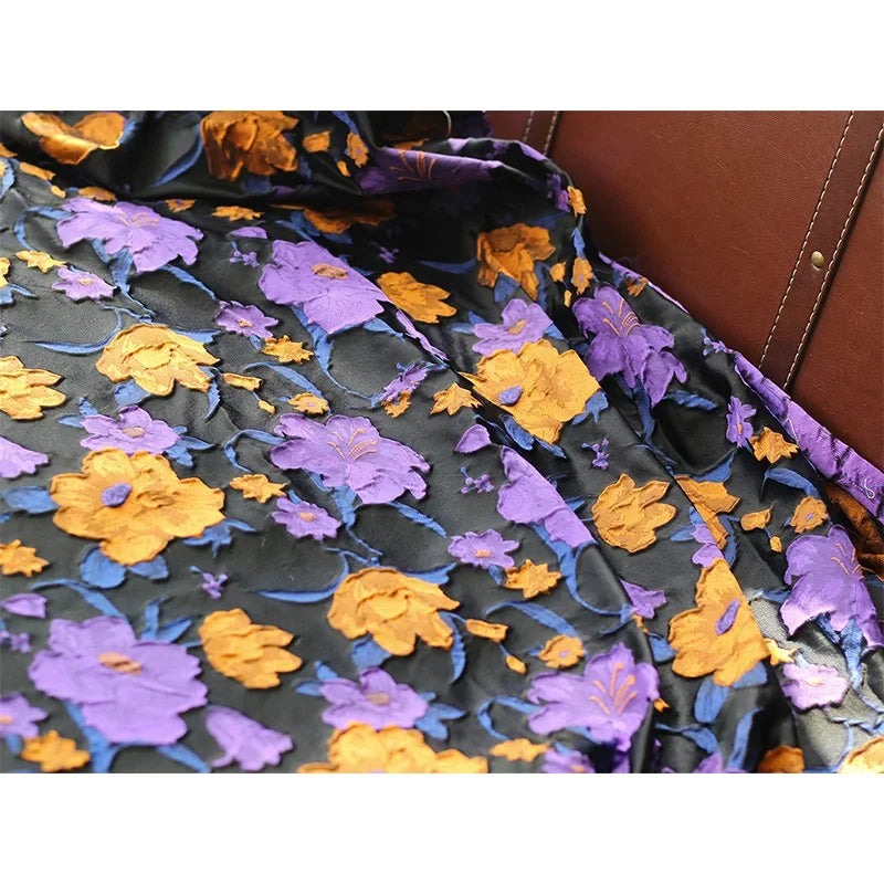 tissu semi transparent floral relief noir violet orange décoration couture jacquard polyester respectueux environnement