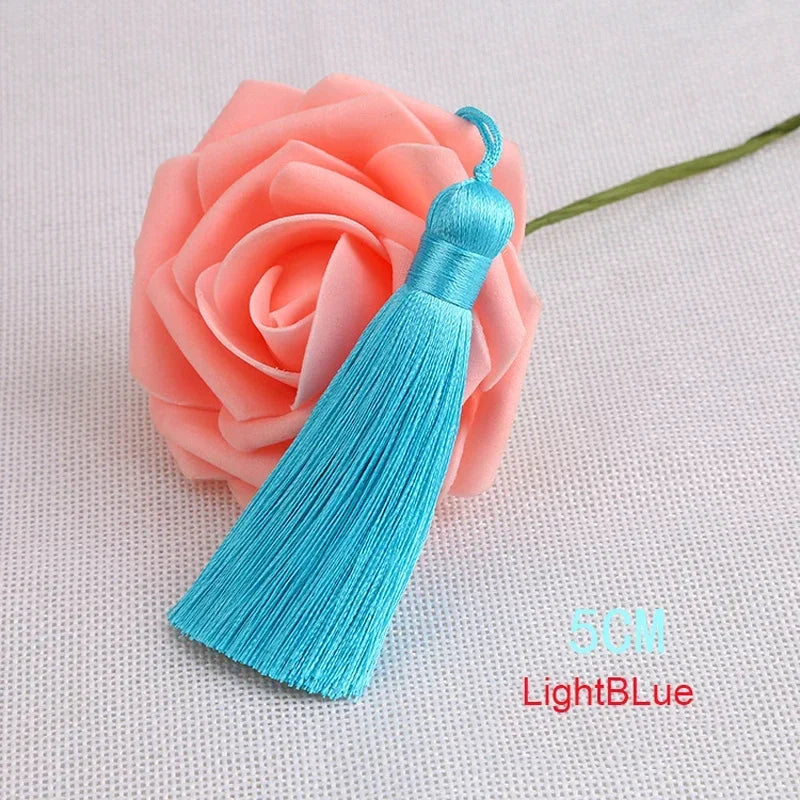 pompons polyester couleur variée 5cm longueur 18cm décoration artisanale rideaux couture pièces