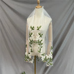 voile mariée tulle blanc brodé feuilles vertes fleurs blanches romantique floral cape femme