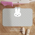 tapis sol absorbant rapide anti dérapant salle bain blanc noir points noirs visage lapin