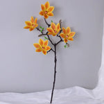 Branche artificielle magnolia fleurs simples feuilles vertes blanc rose jaune verte decoration intérieur