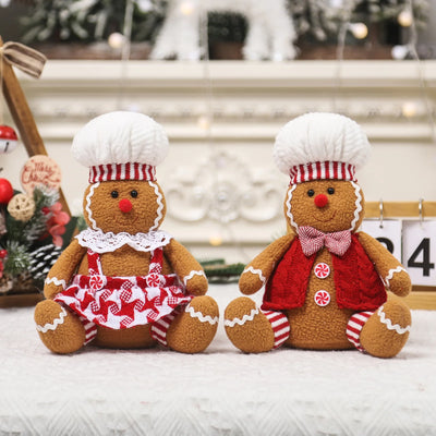 Grand couple bonhomme pain d'épice assis décoration Noël
