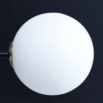 suspension lumineuse moderne minimaliste noir doré blanc sphères translucides métal poli